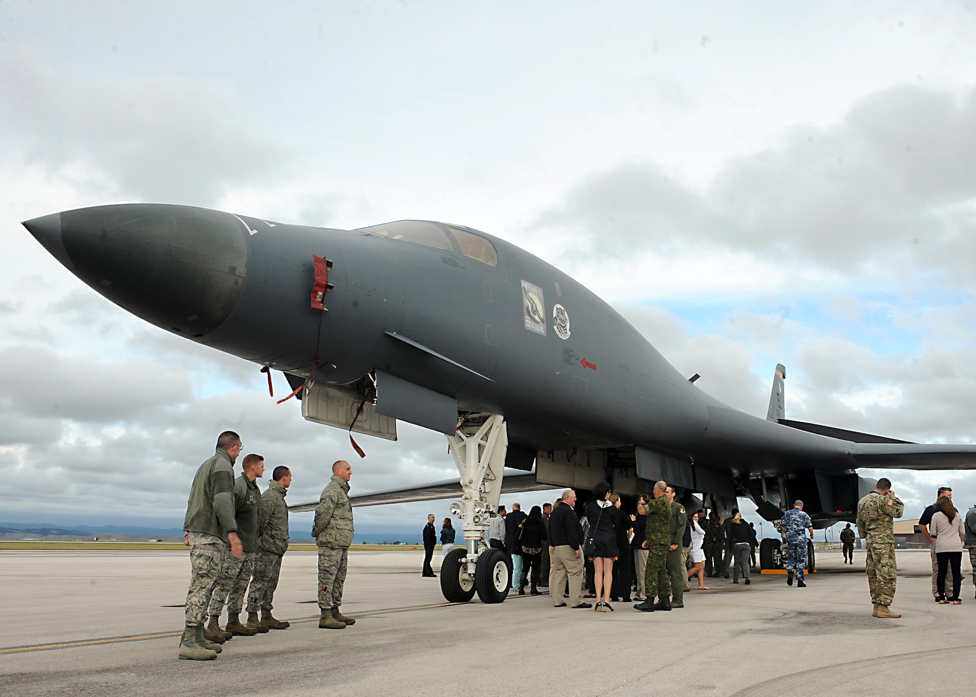 A group of foreign generals and staff members observe a static display of a B-1 bomber at Ellsworth Air Force Base, S.D., Sept. 12, 2016. The event was among five base tours undertaken every six months as a Secretary of Defense-directed engagement for senior military attachés from around the world who are stationed in Washington, D.C. (U.S. Air Force photo by Airman 1st Class Marshall L. Brown)