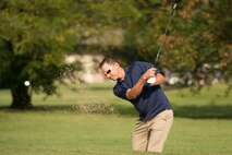 Col. Ethan Griffin, 436th Airlift Wing commander, blasts out of a bunker during the 2016 fall Bluesuiters Golf Tournament Sept. 9, 2016, at the Eagle Creek Golf Course on Dover Air Force Base, Del. This was Griffin’s first tournament since becoming wing commander in the summer of 2016. The biannual tournaments connect local civic and business leaders with Team Dover Airmen. (U.S. Air Force photo by Mauricio Campino)