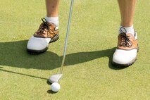 Lt. Col. Mark Radio, 3d Airlift Squadron commander, prepares for a putt at the 2016 fall Bluesuiters Golf Tournament Sept. 9, 2016, at the Eagle Creek Golf Course on Dover Air Force Base, Del.  Radio was one of 12 officers who participated in the biannual golf tournament aimed at connecting Team Dover Airmen with local civic and business leaders. (U.S. Air Force photo by Mauricio Campino)