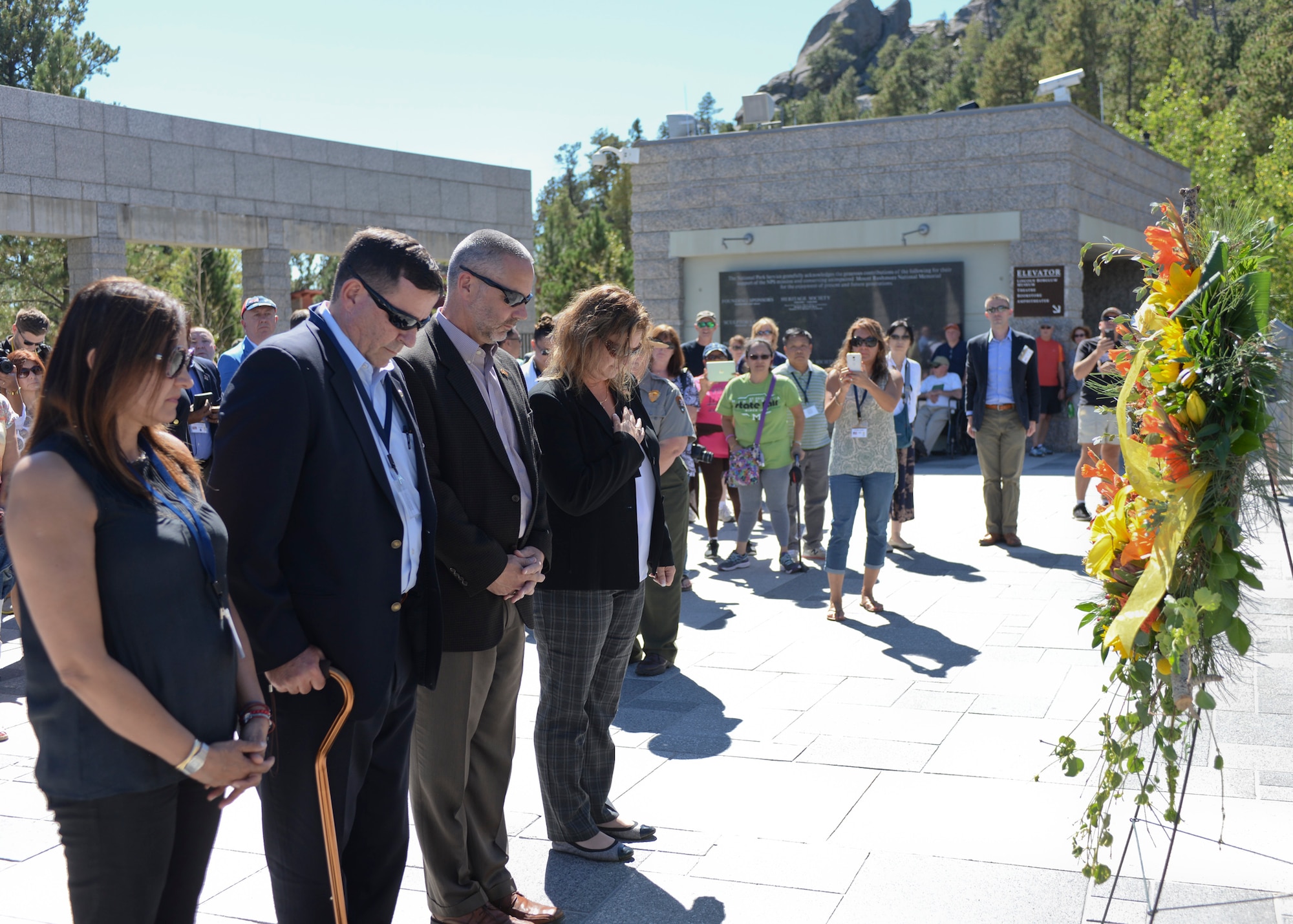 Senior foreign and U.S. attachés stand in silence during a wreath laying ceremony at the Mount Rushmore National Memorial, S.D., Sept. 11, 2016. The ceremony, administered in silence, was conducted in honor of the 15th anniversary of the attacks on Sept. 11, 2001, that occurred in New York, Virginia and Pennsylvania. (U.S. Air Force photo by Senior Airman Anania Tekurio)