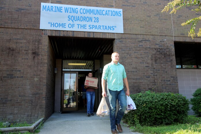 Lance Cpl. David Sigdestad, left, and Cpl. Jacob Williamson carry donated goods during the U.S. Department of Agriculture’s annual Feds Feed Families food drive aboard Marine Corps Air Station Cherry Point, N.C., Sept. 7, 2016. Launched in 2009 as part of President Barack Obama’s United We Serve campaign, the nationwide drive has collected over 52 million pounds of nonperishable food items for people struggling to put food on their table. MCAS Cherry Point personnel were responsible for donating 26,805 pounds of nonperishable food items. Sigdestad is a data network specialist, and Williamson is a Tropospheric Scatter Microwave Radio Terminal 170 operator, both with Marine Wing Communications Squadron 28, Marine Air Control Group 28, 2nd Marine Aircraft Wing. (U.S. Marine Corps photo by Cpl. Jason Jimenez/Released)