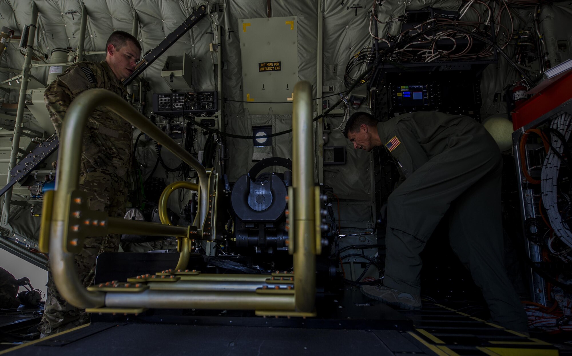 Tech. Sgt. Johnny Hooker and Staff Sgt. Oscar Garcia, aerial gunners with the 1st Special Operations Group Detachment 2, conduct pre-flight inspections of a 105 mm weapon system onboard an AC-130J Ghostrider gunship at Hurlburt Field, Fla., Sept. 8 2016. Pre-flight inspections are performed to ensure the aircraft and its systems are in good condition to fly and perform the mission. (U.S. Air Force photo by Airman 1st Class Isaac O. Guest IV)