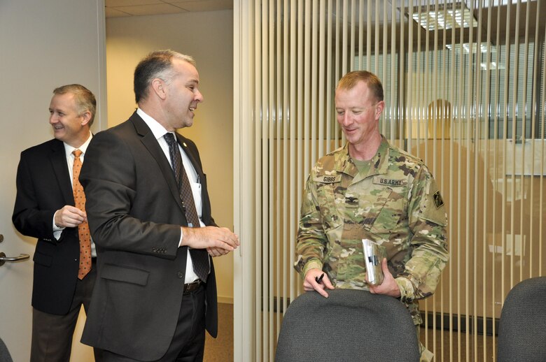 Col. Kirk Gibbs, commander of the U.S. Army Corps of Engineers Los Angeles District, meets with Phoenix City Manager Ed Zuercher (center), Sept. 7. This was the first of three meetings Gibbs and his staff held with city departments. Of note, city officials discussed flood risk management, ecosystem restoration and climate change related projects which mitigate storm water and address flood management interests.