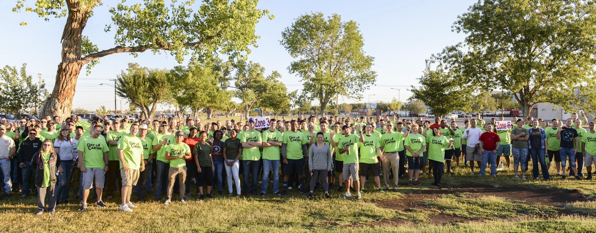 Day of Caring volunteers pose for a group photo at Alameda Park in Alamogordo, N.M. on Sept. 9, 2016. The annual Day of Caring volunteer event, hosted by The United Way of Otero County, helps disabled individuals and senior citizens. (U.S. Air Force photo by Airman Alexis P. Docherty)