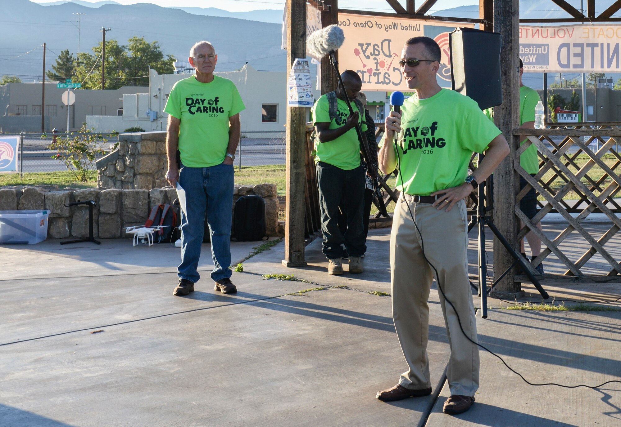 Col. Houston R. Cantwell, the 49th Wing commander, gives an opening speech at the 25th annual Day of Caring volunteer event at Alameda Park in Alamogordo, N.M. on Sept. 9, 2016. The Day of Caring offers support to families, disabled individuals and senior citizens within Otero County communities. (U.S. Air Force photo by Airman Alexis P. Docherty) 