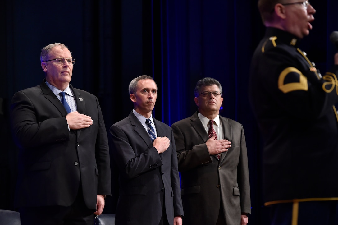 (Left to right) Deputy Defense Secretary Bob Work, Undersecretary of Defense for Intelligence Marcel Lettre and Director of Administration and Management Michael L. Rhodes render honors as an Army vocalist sings the national anthem during the 4th Estate Presidential Rank Awards ceremony at the Pentagon, June 21, 2016. Lettre spoke at the Atlantic Council in Washington, Sept. 13, 2016, discussing the need for transparency in the intelligence community. DoD photo by Air Force Senior Master Sgt. Adrian Cadiz