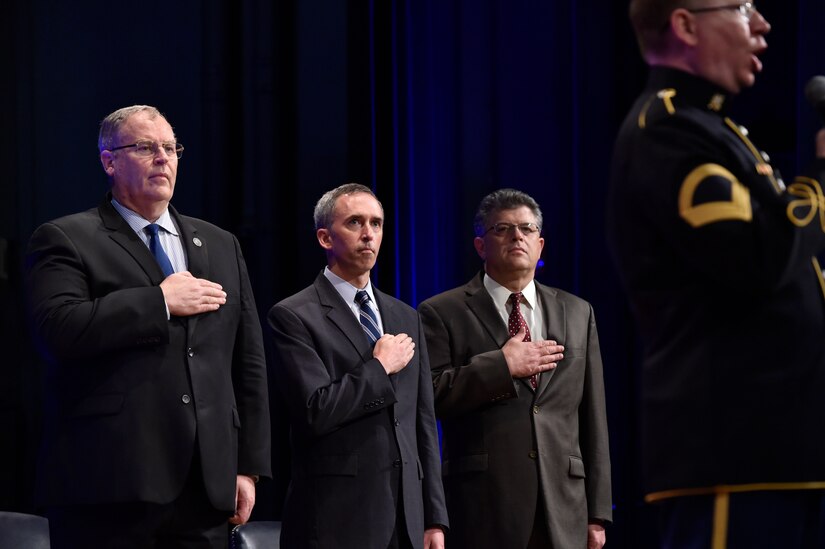 (Left to right) Deputy Defense Secretary Bob Work, Undersecretary of Defense for Intelligence Marcel Lettre and Director of Administration and Management Michael L. Rhodes render honors as an Army vocalist sings the national anthem during the 4th Estate Presidential Rank Awards ceremony at the Pentagon, June 21, 2016. Lettre spoke at the Atlantic Council in Washington, Sept. 13, 2016, discussing the need for transparency in the intelligence community. DoD photo by Air Force Senior Master Sgt. Adrian Cadiz