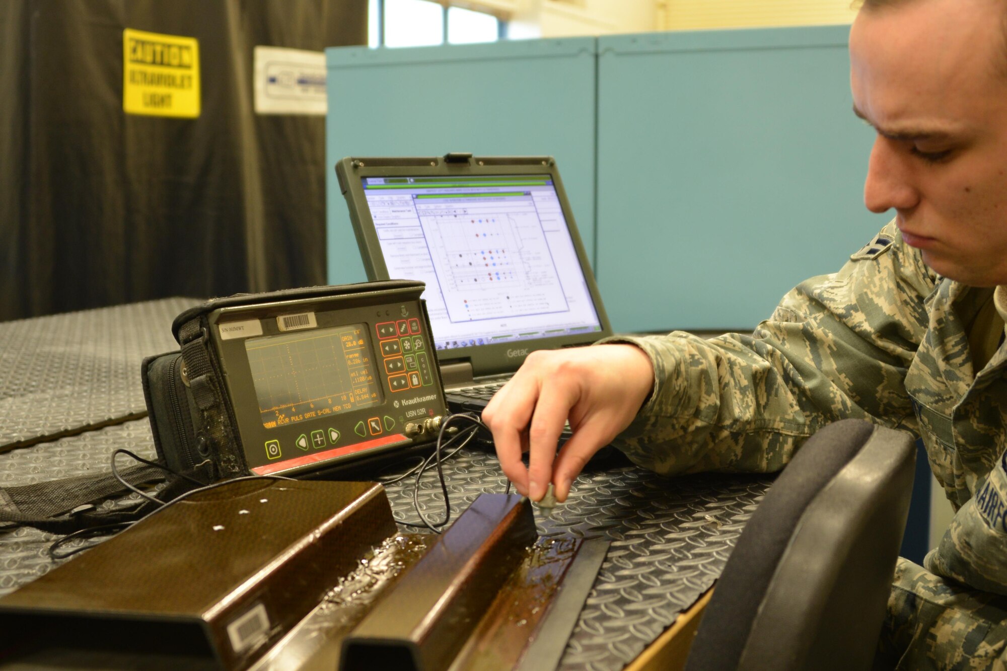 An Air Force Airman from the 3rd Maintenance Squadron Non Destructive Inspection Flight, performs special inspections on aircraft parts Sept. 13, 2016 at Joint Base Elmendorf-Richardson, Alaska. 
USAF Photo by Staff. Sgt. Michael Campbell.