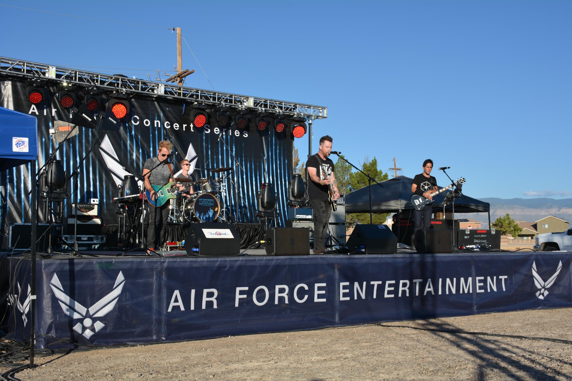 David Cook, the American Idol Season Seven winner, and his band perform a song at Holloman Air Force Base, N.M. on Sept. 11, 2016. The 49th Force Support Squadron hosted the event, which is Cook’s 10th Air Force Base he has visited on this tour. (U.S. Air Force photo by Staff Sgt. Warren Spearman)