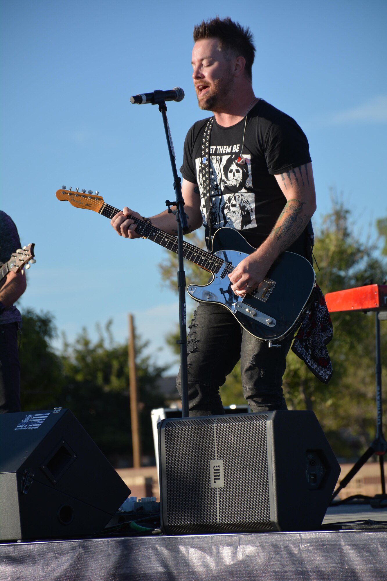 David Cook, the American Idol Season Seven winner, performs a song at Holloman Air Force Base, N.M. on Sept. 11, 2016. The 49th Force Support Squadron hosted the event, which is Cook’s 10th Air Force Base he has visited on this tour. (U.S. Air Force photo by Staff Sgt. Warren Spearman)