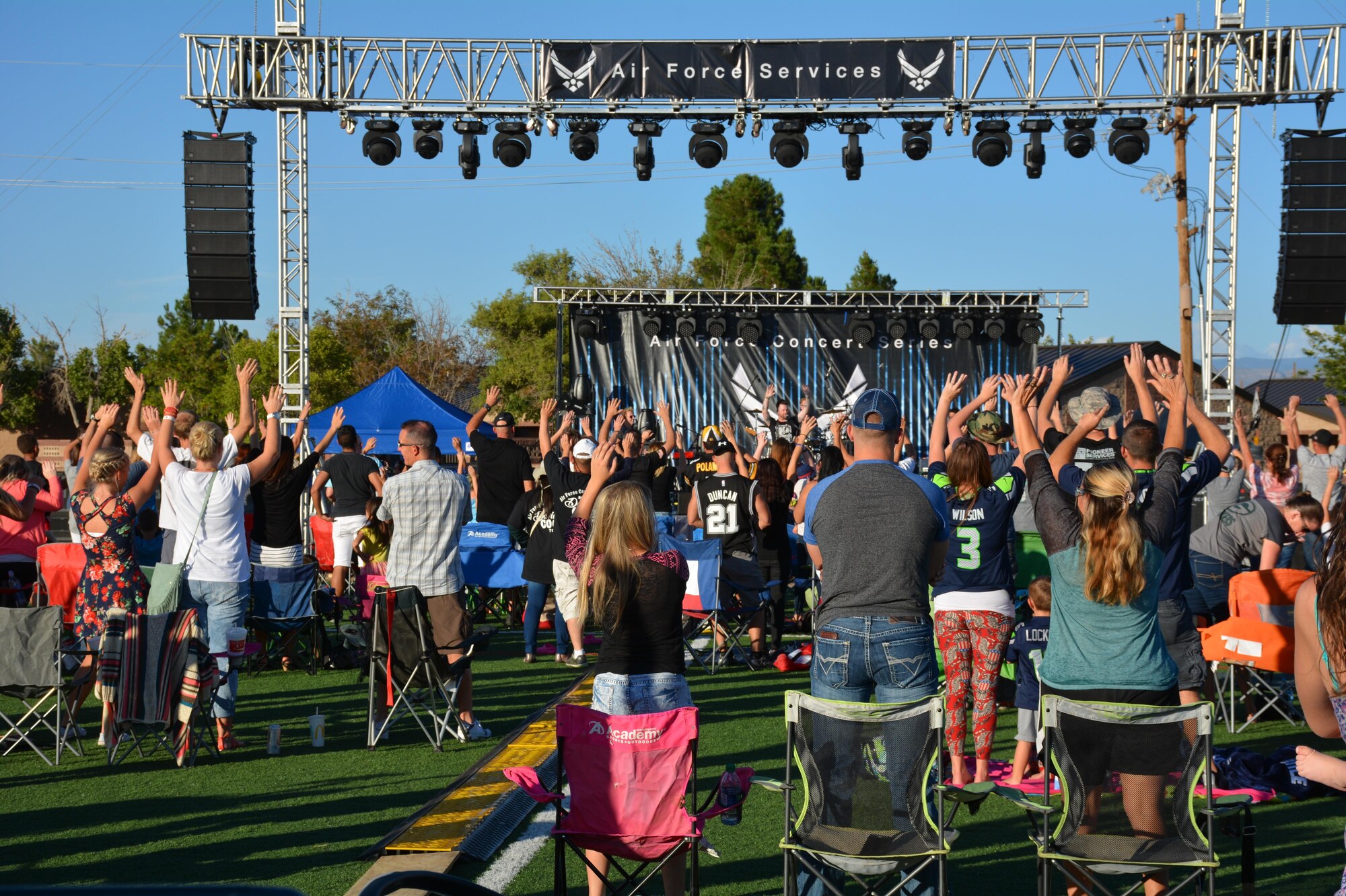 David Cook, the American Idol Season Seven winner, involves the Team Holloman family in a performance at Holloman Air Force Base, N.M. on Sept. 11, 2016. The 49th Force Support Squadron hosted the event, which is Cook’s 10th Air Force Base he has visited on this tour. (U.S. Air Force photo by Staff Sgt. Warren Spearman)