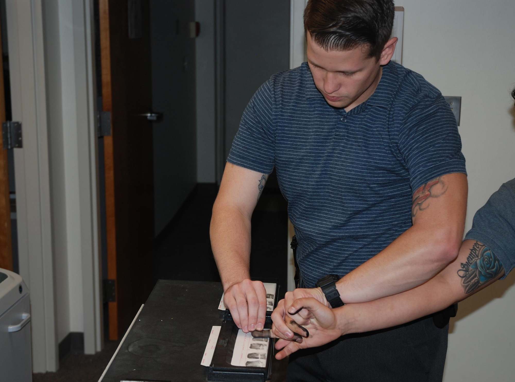 PETERSON AIR FORCE BASE, Colo. – 21st Security Forces Squadron Investigator Seth McElyea takes finger prints as part of his investigative duties Sept. 12, 2016. SFS investigators bring experience and advanced training to the fight alongside other defenders to fulfill the squadron’s mission. (U.S. Air Force photo by Dave Smith)