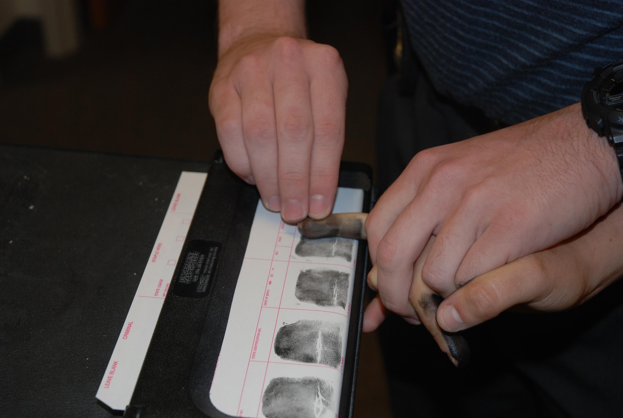 PETERSON AIR FORCE BASE, Colo. – Recording fingerprints is one way 21st Security Forces Squadron investigators gather information about a potential incident. Investigators work with patrols to make sure proper investigative practices are utilized on any case needing a closer look. (U.S. Air Force photo by Dave Smith)