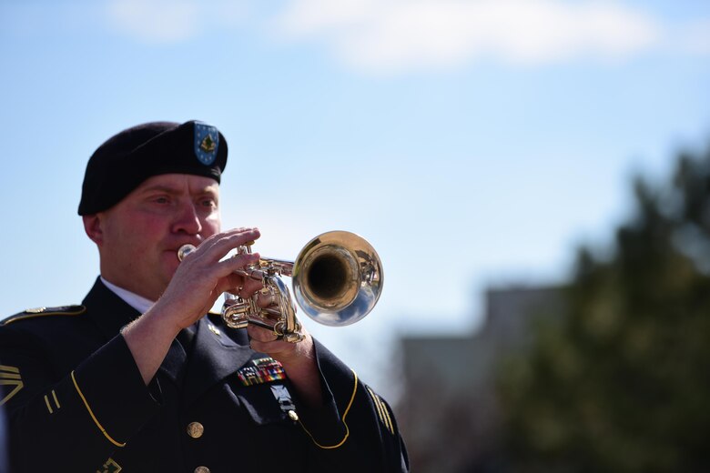 PETERSON AIR FORCE BASE, Colo. – Staff Sgt. Grady Kersh, 4th ID Band member, plays taps at the close of 9/11 Remembrance Ceremony on Peterson Air Force Base, Colo., Sept. 11, 2016. The ceremony paid respect to the lives lost in the terrorist attacks of 9/11 with the ringing of the “four fives,” a salute volley, presentation of wreaths and the playing of taps. (U.S. Air Force photo by Staff Sgt. Amber Grimm)