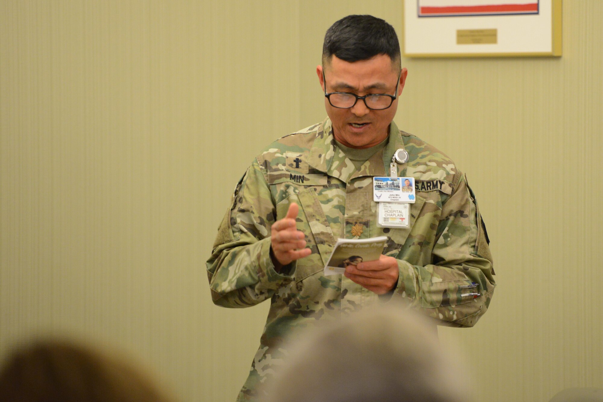 Army Maj. John Min, 673d Medical Group chaplain, leads attendees in prayer following a Re-Creation USA performance at the Alaska Fisher House, at Joint Base Elmendorf-Richardson, Alaska, Sept. 9, 2016. Re-Creation returned to Alaska after a seven-year absence. 