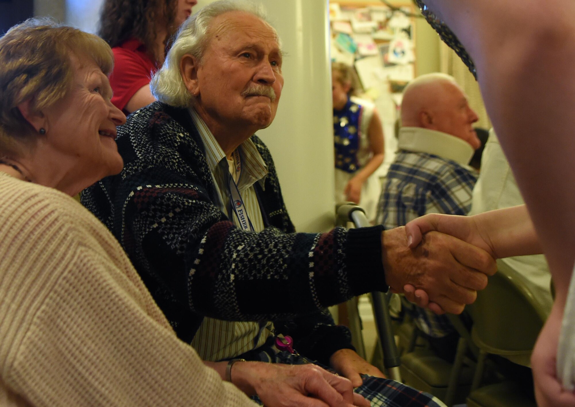 Hannah Swanson, Austin Keretzman and Jonathan Hepler, Re-Creation USA performers, sing a patriotic song while they hold their hands to their hearts during a performance at the Alaska Fisher House at Joint Base Elmendorf-Richardson, Alaska, Sept. 9, 2016. The next day’s performance took the group to the state veteran’s home in Palmer. 