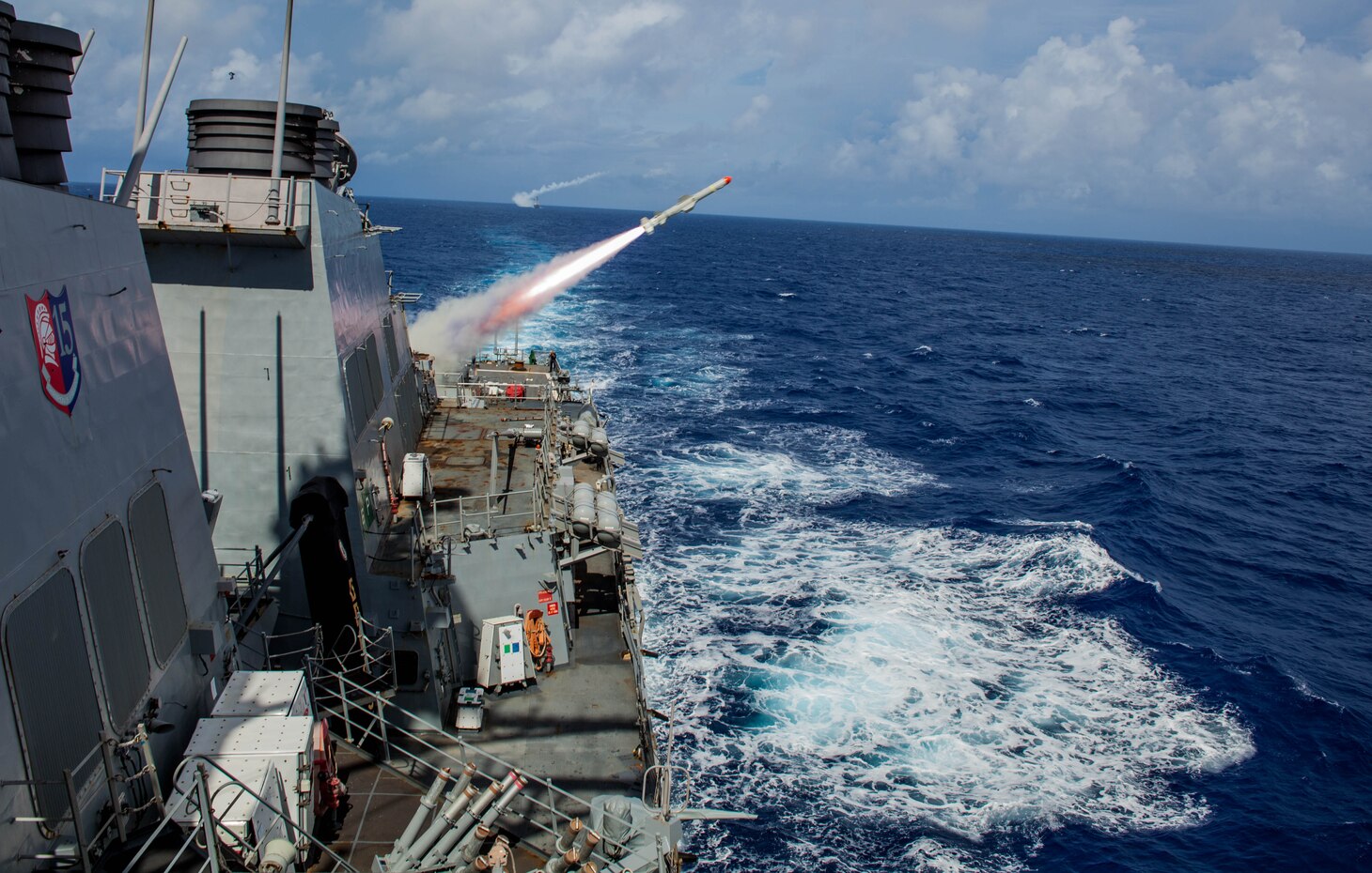 (Sept. 13, 2016) The Arleigh Burke-class guided-missile destroyer USS Benfold (DDG 65) conducts a live fire of a harpoon missile, with the Arleigh Burke-class guided-missile destroyer USS John S. McCain (DDG 56), as part of a sink exercise (SINKEX) during Valiant Shield 2016. Valiant Shield is a biennial, U.S. only, field-training exercise with a focus on integration of joint training among U.S. forces. This is the sixth exercise in the Valiant Shield series that began in 2006. Benfold is on patrol with Carrier Strike Group Five in the Philippine Sea supporting security and stability in the Indo-Asia-Pacific region. (U.S. Navy photo by Sonar Technician (Surface) 2nd Class Aaron Lyons/Released)