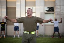 Maj. Gen. Charles Chiarotti, US Forces, Japan commander, leads warm up before participating in the USFJ Command 5K Run at Yokota Air Base, Japan, Sept. 9, 2016. Over 100 service member participated in the run, which concluded with the retirement of the old USFJ colors and the unveiling of the new USFJ colors. (U.S. Air Force photo by Yasuo Osakabe/Released)