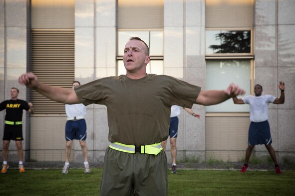 Maj. Gen. Charles Chiarotti, US Forces, Japan commander, leads warm up before participating in the USFJ Command 5K Run at Yokota Air Base, Japan, Sept. 9, 2016. Over 100 service member participated in the run, which concluded with the retirement of the old USFJ colors and the unveiling of the new USFJ colors. (U.S. Air Force photo by Yasuo Osakabe/Released)