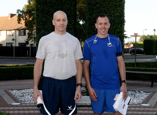 U.S. Air Force Maj. Joshua Tyson, 488th Intel Squadron director of operations, left, and U.S. Air Force Lt. Dustin Murray, 100th Force Support Squadron Food and Fitness Operations chief, right, receive the awards for the best time in the male class following the Patriot Day 5K Sept. 9, 2016, on RAF Mildenhall, England. The event was held in remembrance of the victims and first responders who lost their lives on Sept. 11, 2001. (U.S. Air Force photo by Airman 1st Class Tenley Long) 