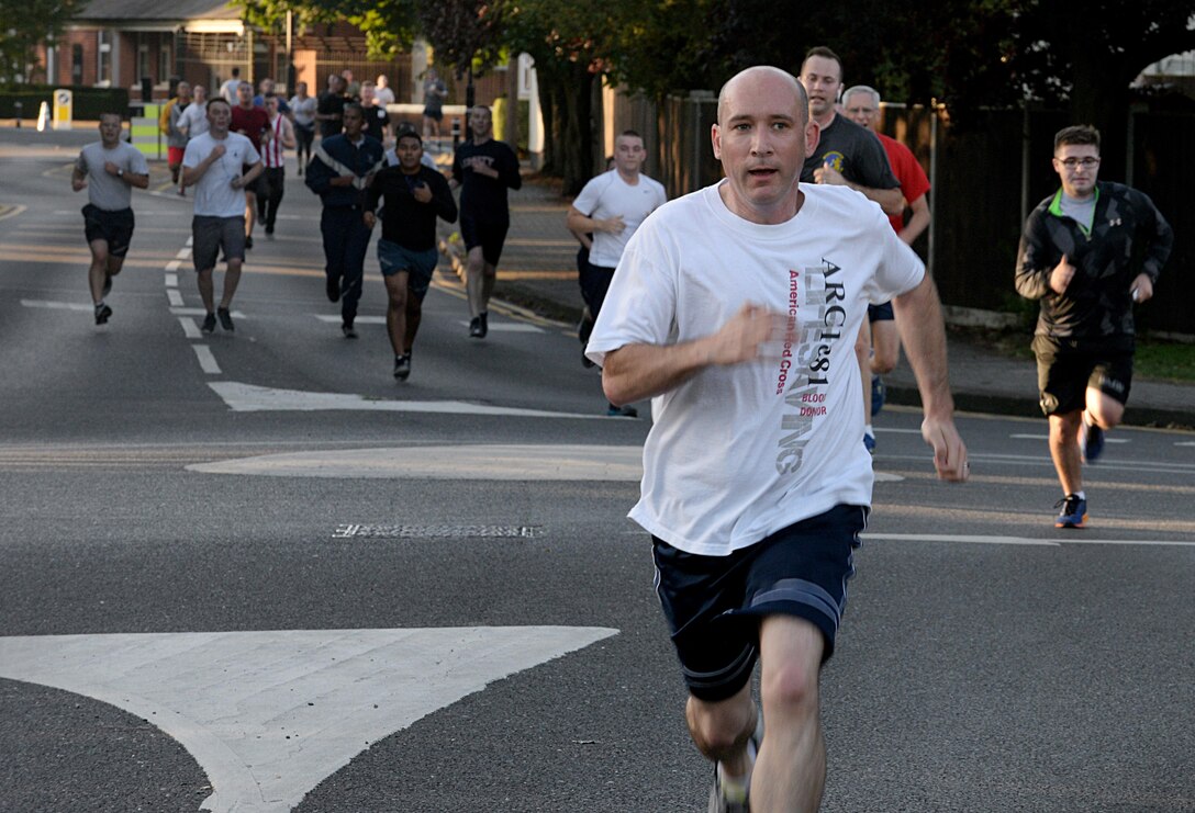 U.S. Air Force Chief Master Sgt. Curtis Stanley, 100th Air Refueling Wing command chief, participates in the Patriot Day 5K Sept. 9, 2016, on RAF Mildenhall, England. The event was held in remembrance of the victims and first responders who lost their lives Sept. 11, 2001. (U.S. Air Force photo by Airman 1st Class Tenley Long)