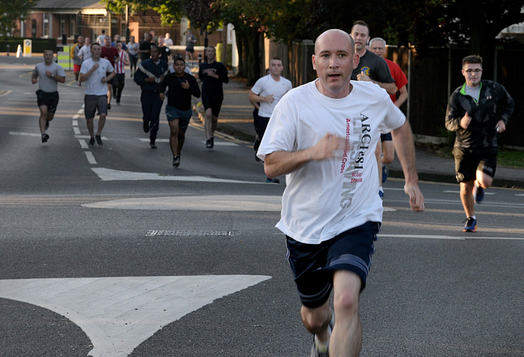 U.S. Air Force Chief Master Sgt. Curtis Stanley, 100th Air Refueling Wing command chief, participates in the Patriot Day 5K Sept. 9, 2016, on RAF Mildenhall, England. The event was held in remembrance of the victims and first responders who lost their lives Sept. 11, 2001. (U.S. Air Force photo by Airman 1st Class Tenley Long)