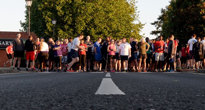 Team Mildenhall members prepare to run in the Patriot Day 5K Sept. 9, 2016, on RAF Mildenhall, England.  The event was held in remembrance of the victims and first responders who lost their lives Sept. 11, 2001. (U.S. Air Force photo by Airman 1st Class Tenley Long) 
