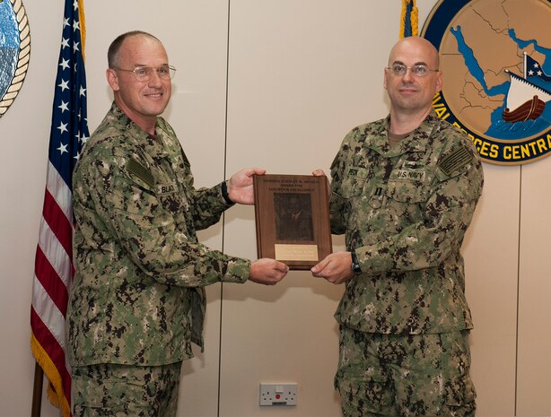 (Sept. 7, 2016) Rear Adm. Eugene Black, deputy commander of U.S. Naval Forces Central Command (NAVCENT) presents the Admiral Stanley R. Arthur Award for Logistics Excellence to Lt. Nathan Peck, a native of Orlando, Fla. assigned to Commander, Task Force (CTF) 53, aboard Naval Support Activity Bahrain. Peck was selected as the Logistician of the Year for the 2015 Adm. Stanley R. Arthur Award, which was established in 1997 as an annual award to recognize both individuals and teams that exemplify logistics professionalism and excellence.  