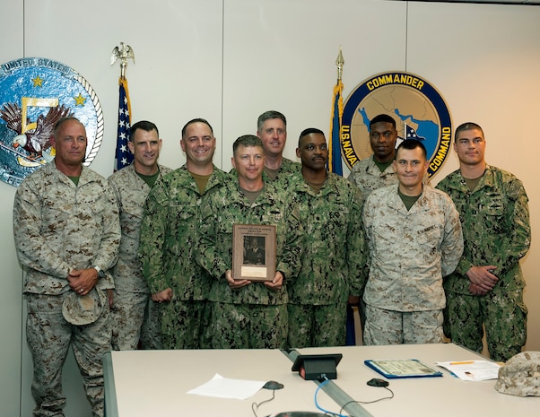 Members of U.S. Naval Forces Central Command's (NAVCENT)  Commander, Task Force (CTF) 51, are presented the 2015 Adm. Stanley R. Arthur Logistics Team Award aboard Naval Support Activity Bahrain. The Adm. Stanley R. Arthur Award was established in 1997 as an annual award to recognize both individuals and teams that exemplify logistics professionalism and excellence.