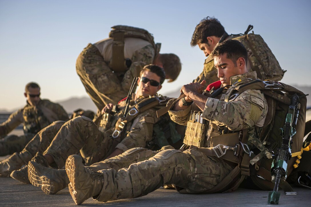 Airmen check their equipment before participating in an aerial insertion and recovery exercise at Bagram Airfield, Afghanistan, Sept. 3, 2016. The airmen are pararescuemen assigned to the 83rd Expeditionary Rescue Squadron. Airmen assigned to the 774th Expeditionary Airlift Squadron, and 455th Expeditionary Aeromedical Evacuation Squadron also participated in the aerial insertion of personnel recovery team. Air Force photo by Senior Airman Justyn M. Freeman