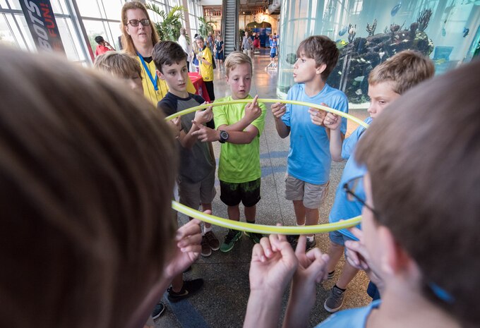 Approximately 350 students attended the 2016 Charleston Area Regional “FIRST LEGO League (FLL) Kick-off” on September 6, at the South Carolina Aquarium.  The event was presented by the South Carolina FLL, SPAWAR Systems Center (SSC) Atlantic and South Carolina Aquarium in collaboration with Boeing and Hanahan Recreation and Parks. The mission of For Inspiration and Recognition of Science and Technology (FIRST) is to inspire young people to become science and technology leaders. 