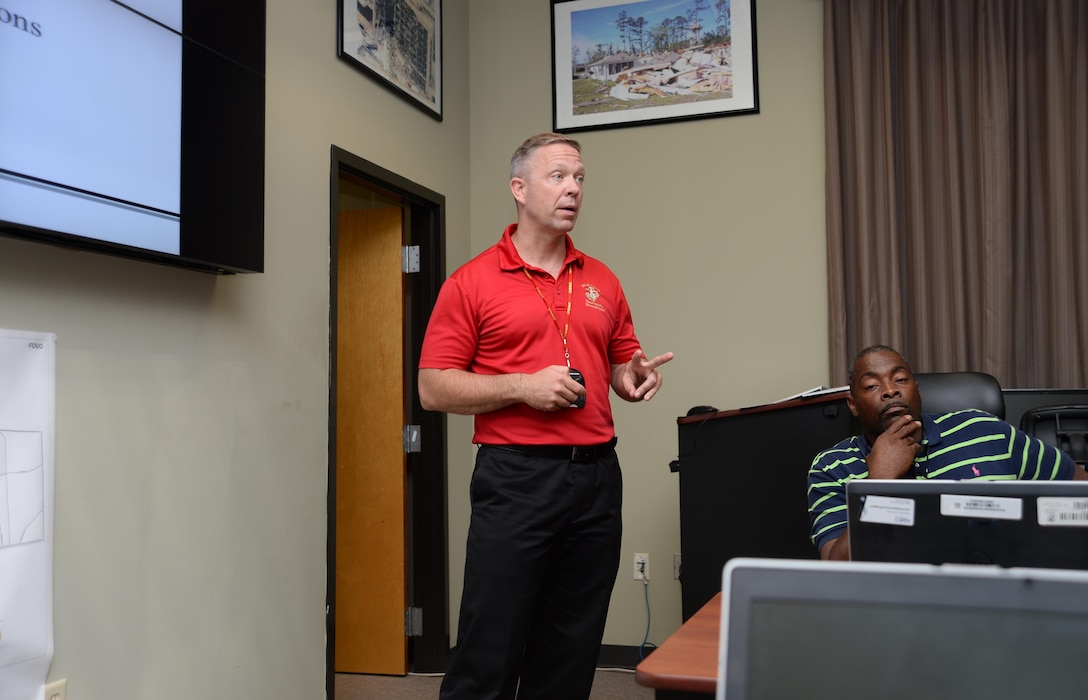 Steven Dancer (left), installation emergency manager, Marine Corps Logistics Base Albany, gives an update on some strategies and precautions the installation’s emergency operations, chemical protection and Naval Branch Health Clinic-Albany’s personnel are implementing to combat the Zika virus. Base officials, recently, hosted a meeting with state and local environmental control representatives to discuss the impact of the mosquito-borne illness as well as some countermeasures to reduce the mosquito larvae population.
