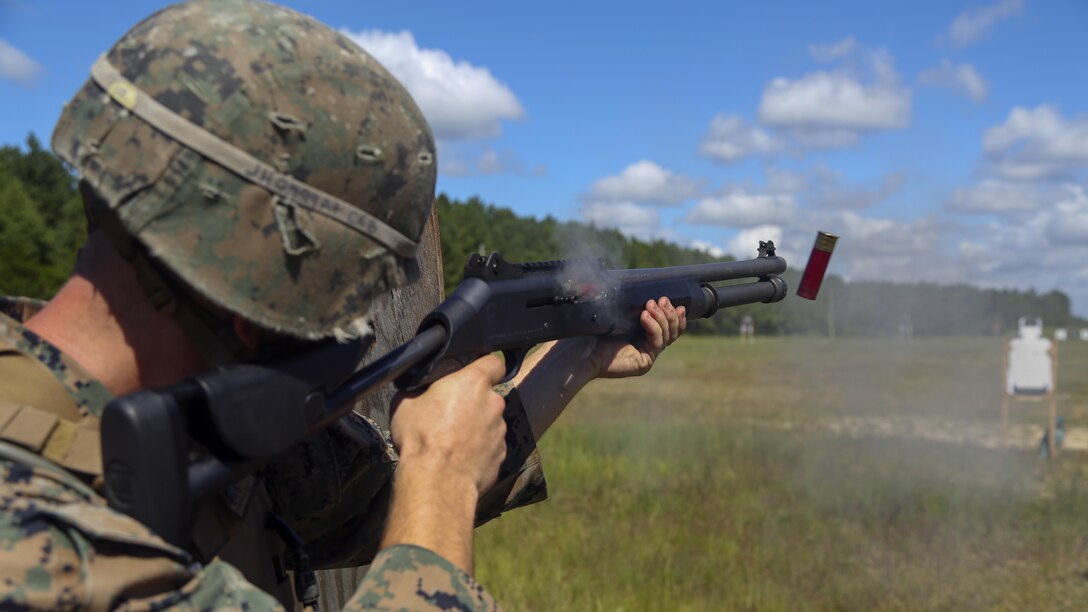 Cpl. Joshua Hodel, Stone Bay target shed noncommissioned officer in charge, fires a Benelli M4 shotgun at a target during a 3-gun shooting competition coordinated by the Combat Marksmanship Trainer Course at Stone Bay on Marine Corps Base Camp Lejeune, N.C., Sept. 1, 2016. The competition enabled CMT students to become familiar with how to set up and run a range and range personnel were also able to hone their marksmanship skills.