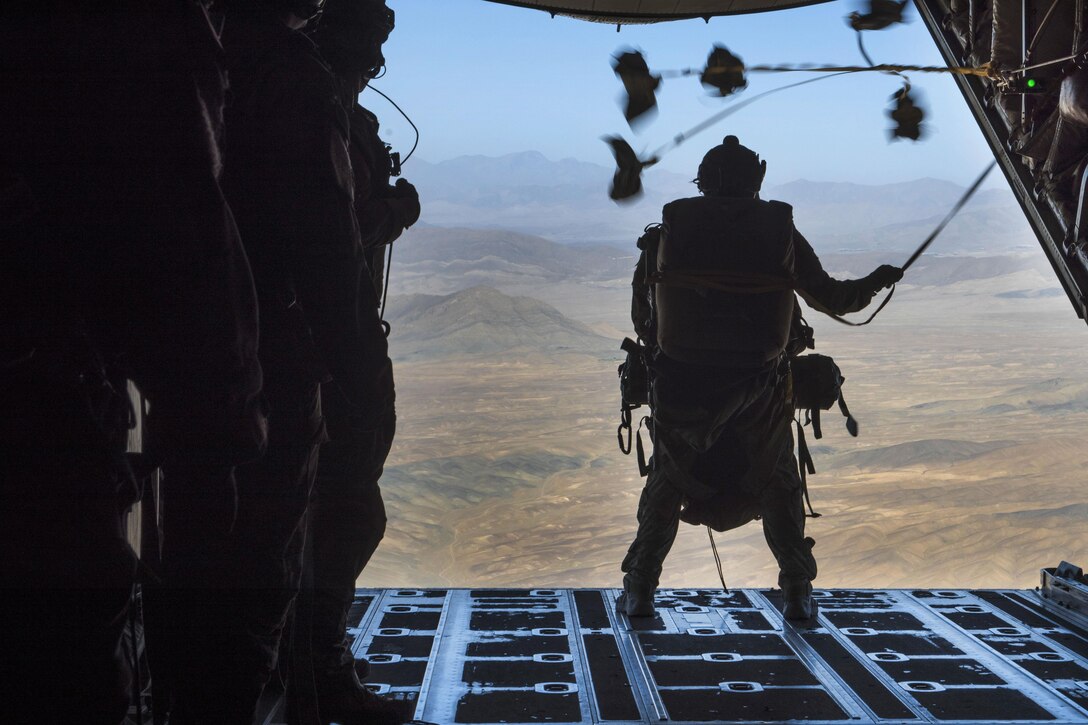 Air Force Staff Sgt. Benjamin Cole prepares to jump out of a C-130J Super Hercules aircraft during an aerial insertion and recovery exercise at Bagram Airfield, Afghanistan, Sept. 3, 2016. Cole is a pararescuemen assigned to the 83rd Expeditionary Rescue Squadron. Air Force photo by Senior Airman Justyn M. Freeman