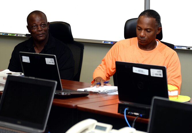 Donnell Mathis (left), environmental control manager, Dougherty County Public Works, and Napolean Butler (right), vector surveillance coordinator, Georgia Department of Public Health, Environmental Health Division, collaborate with Marine Corps Logistics Base Albany officials, recently. The team met with MCLB Albany emergency operations, chemical protection and Naval Branch Health Clinic-Albany’s personnel to identify strategies to fight against the Zika virus and to discuss how residents can be proactive in this effort to mitigate the mosquito-borne illness.