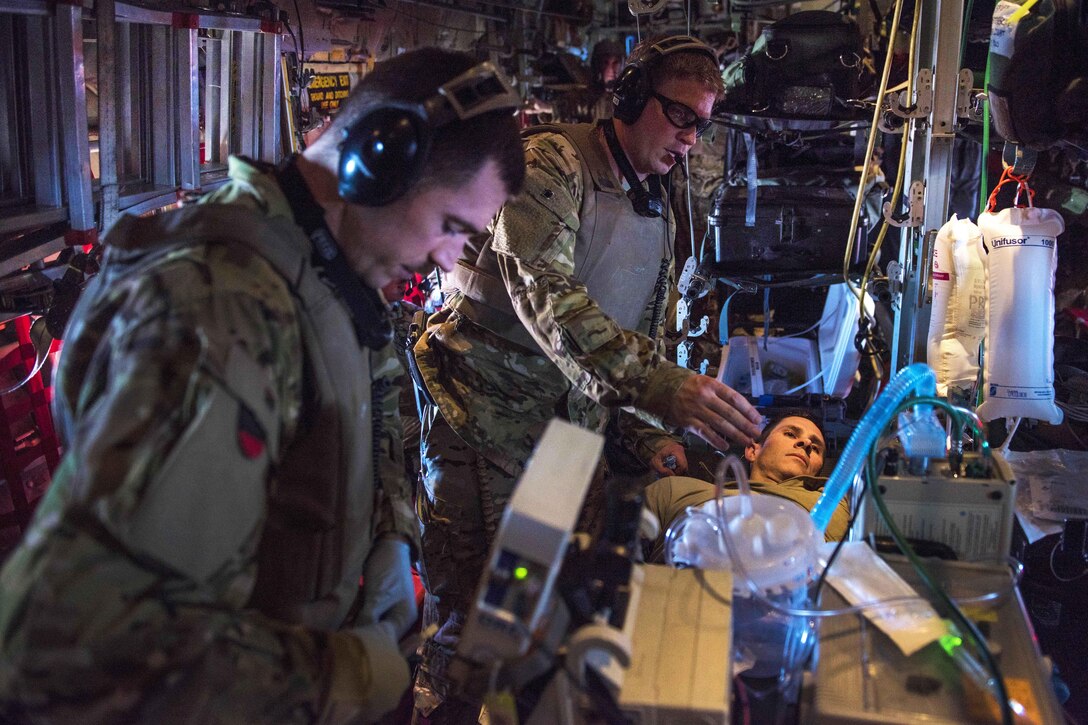 Air Force Capt. Antonio Stone, left, and Air Force Maj. Johnathan Henderson insert a chest tube into simulated casualty during a recovery exercise at Bagram Airfield, Afghanistan, Sept. 3, 2016. Stone is a nurse and Henderson is a doctor assigned to the 455th Expeditionary Aeromedical Evacuation Critical Care Air Transport Team. Air Force photo by Senior Airman Justyn M. Freeman 