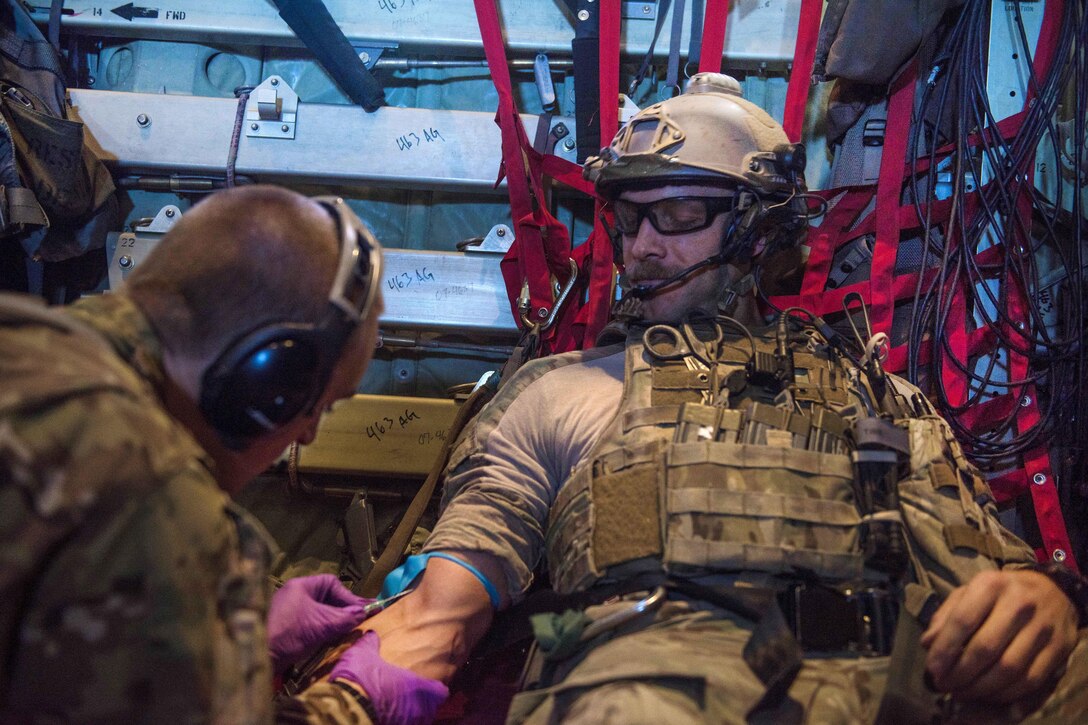 Air Force Staff Sgt. Roderick Campbell has an intravenous needle placed into his arm during a recovery exercise at Bagram Airfield, Afghanistan, Sept. 3, 2016. Campbell is assigned to the 83rd Expeditionary Rescue Squadron. Air Force photo by Senior Airman Justyn M. Freeman