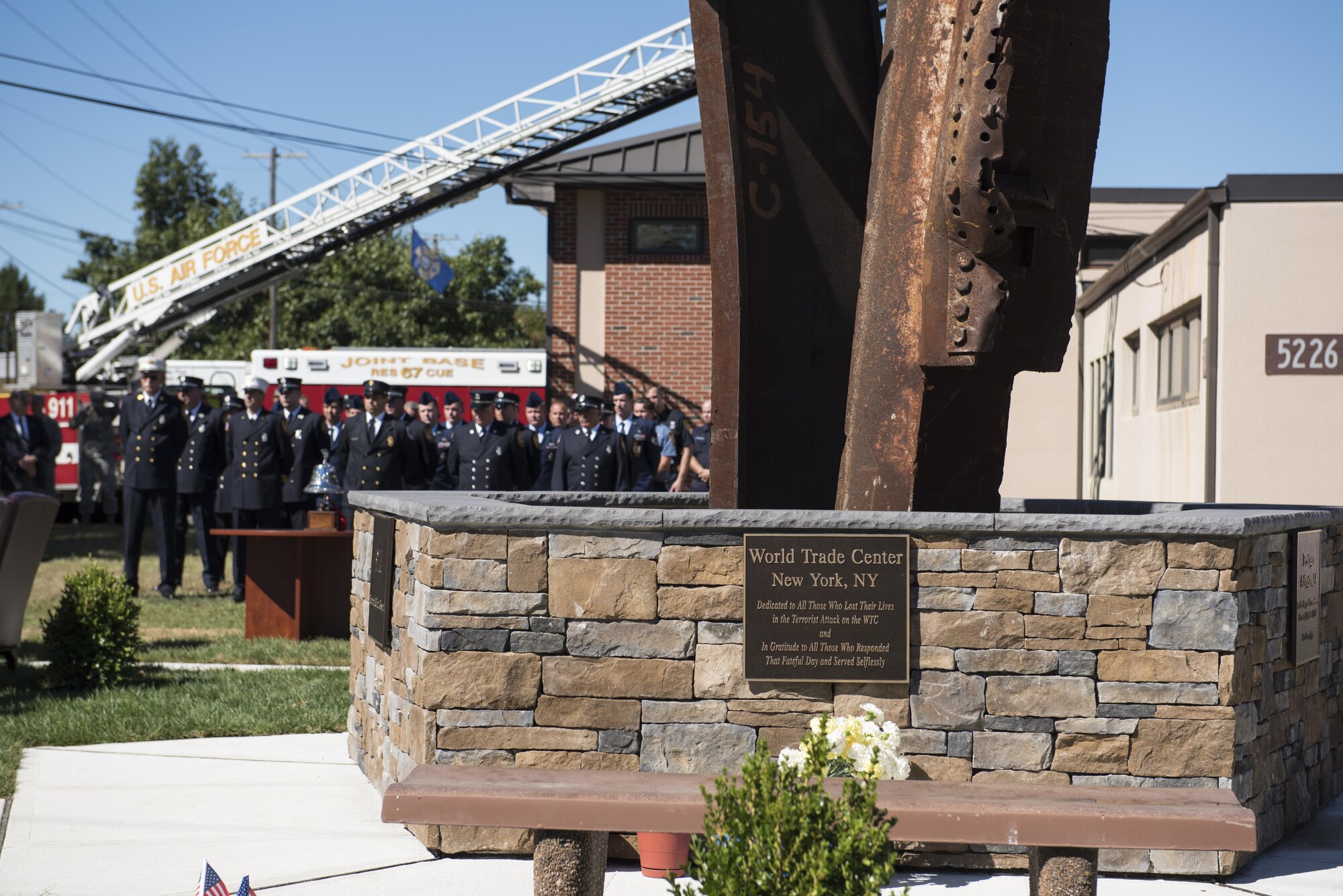 The new 9/11 memorial at Fire Station 4 is commemorated during a ceremony at Joint Base McGuire-Dix-Lakehurst, N.J., Sept. 12, 2016. The memorial is constructed with the mangled steel beams of the World Trade Center towers.