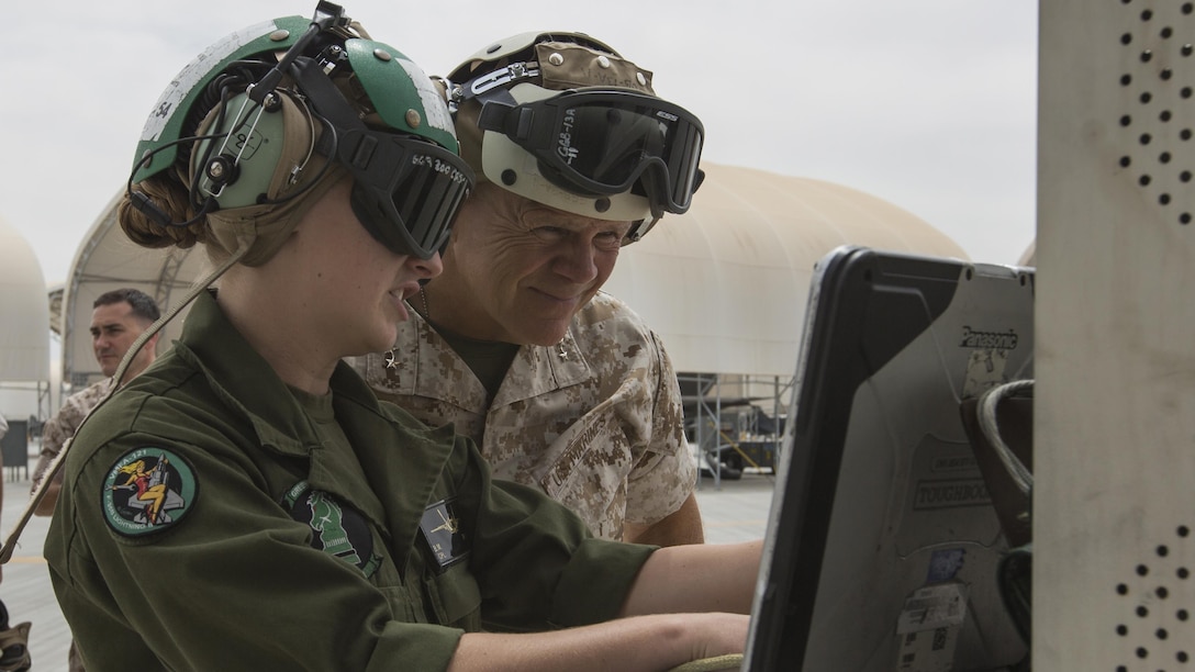 Commandant of the Marine Corps Gen. Robert B. Neller, right, observes equipment during a tour a Marine Corps Air Station Yuma, Ariz., Sept. 13, 2016. Neller visited Yuma to meet with Marines and tour facilities.