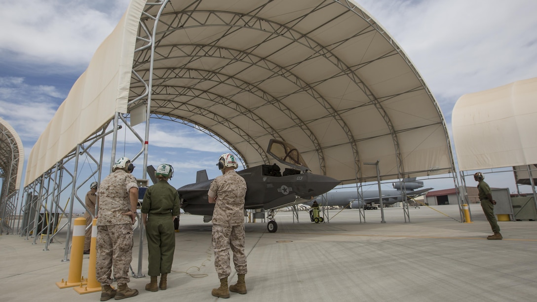 Commandant of the Marine Corps Gen. Robert B. Neller, left, observes equipment during a tour a Marine Corps Air Station Yuma, Ariz., Sept. 13, 2016. Neller visited Yuma to meet with Marines and tour facilities.