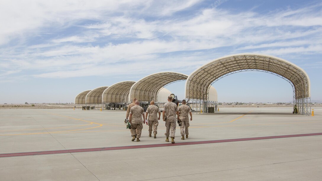 Commandant of the Marine Corps Gen. Robert B. Neller walks with Marines during a tour at Marine Corps Air Station Yuma, Ariz., Sept. 13, 2016. Neller visited Yuma to meet with Marines and tour facilities.
