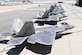 Seven F-22A Raptors sit outside the 411th Flight Test Squadron Aug. 10. Four operational jets from three different bases are at Edwards for testing to help improve the long-term combat capability of the F-22 Raptor. (U.S. Air Force photo by Christian Turner)