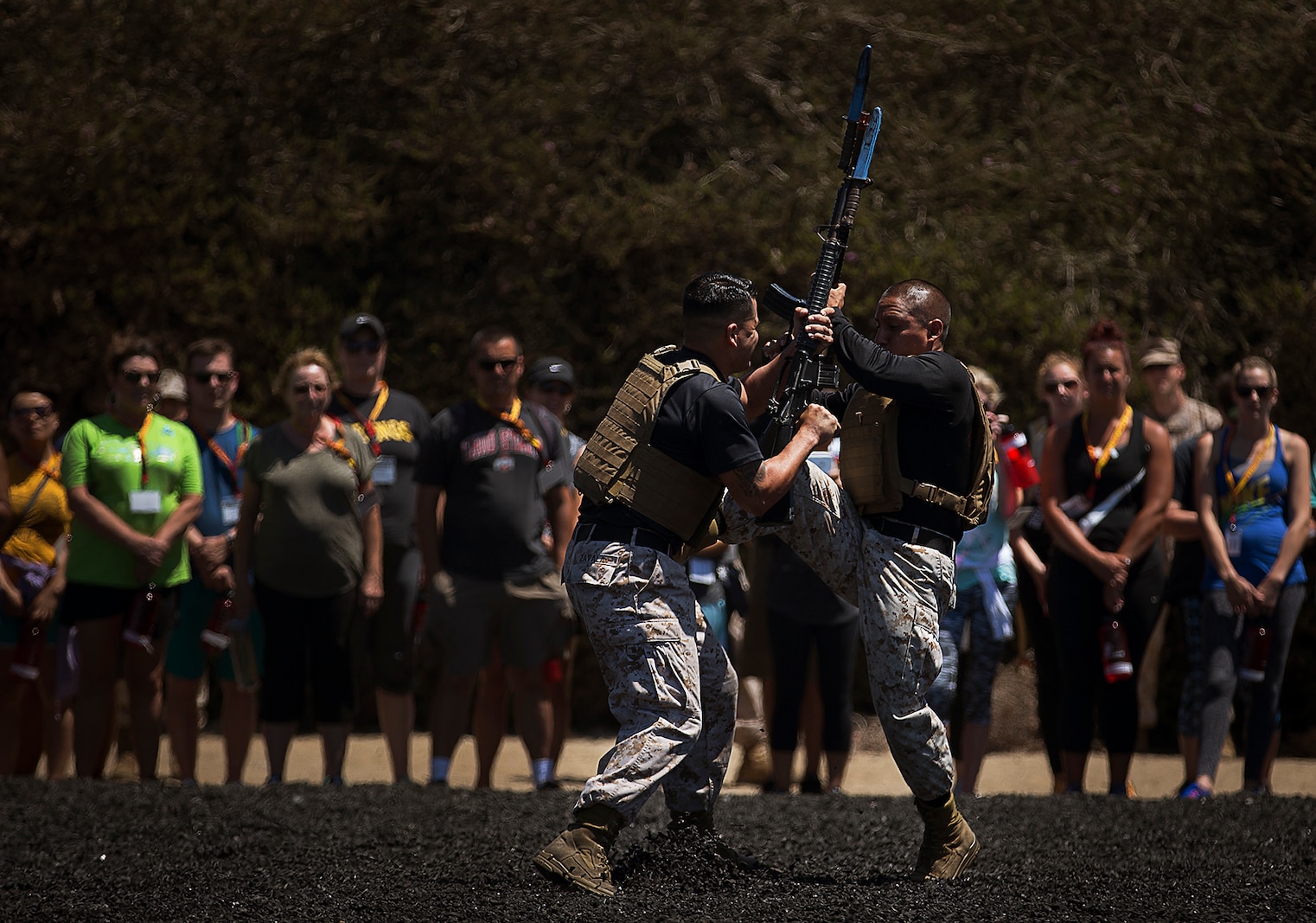 Sgts. Nelson Chavez (right) and Milton Zavala, both Marine Corps drill instructors, demonstrate Marine Corps Martial Arts Program techniques for high school teachers from Washington, Oregon, Idaho and Montana during an Educators Workshop at Marine Corps Recruit Depot San Diego, Aug. 16, 2016. The mission of the Educators Workshop is to inform, demonstrate and build relationships while providing educators and community influencers with firsthand knowledge of the Marine Corps recruiting process, entry level training, job opportunities and educational benefits available to Marines. Chavez is from Miami. Zavala is from Houston. (U.S. Marine Corps photo by Staff Sgt. Reece Lodder)