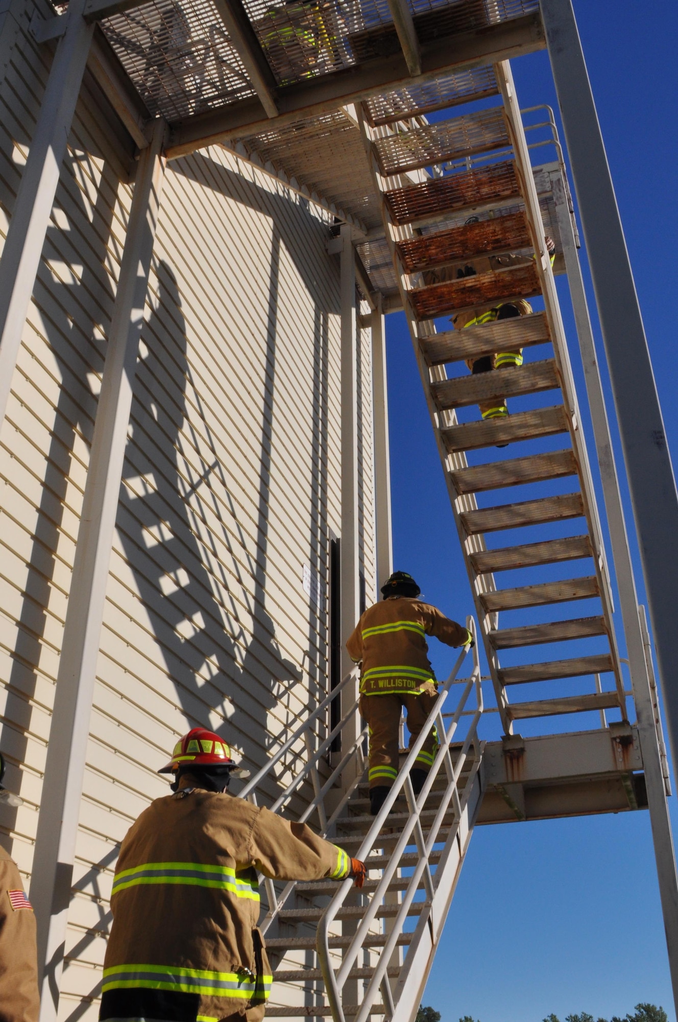 Okie firefighters from the 507th Civil Engineer Squadron honor the fallen with their 7th annual fire climb Sept. 11, 2016, at Tinker Air Force Base, Okla. To remember the victims and heroes who perished on that day, 15 years ago, Reservists climb up and down the fire-training tower to complete the 18 laps within 56 minutes, the amount of time it took the South Tower of the World Trade Center to collapse. (U.S. Air Force photo/Master Sgt. Grady Epperly)
