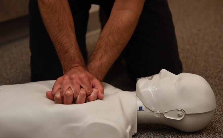 PETERSON AIR FORCE BASE, Colo. – Joe Partoll, 21st Aerospace Medicine Squadron environmental engineer, practices chest compressions on a CPR dummy at Peterson Air Force Base, Colo., Sept. 9, 2016. Partoll has been CPR certified since he began working at Peterson AFB in 2008. (U.S. Air Force photo by Airman 1st Class Dennis Hoffman)