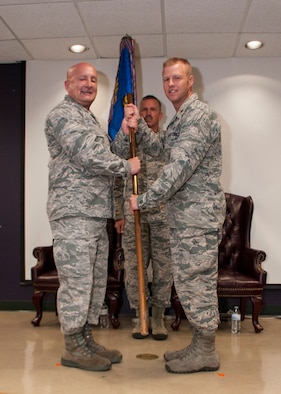 Lt. Col. Richard Ropac, 507th Mission Support Group commander, passes the guidon to Maj. Ricky Martin II, new commander of the 507th Security Forces Squadron, at his assumption of command ceremony Sept. 11, 2016, at Tinker Air Force Base, Oklahoma. Martin has served in various capacities to include: nuclear security, presidential support, antiterrorism, security forces operations, Iraqi Police transition team and contingency operations. Martin has also worked as a Federal Reserve Law Enforcement Officer in Salt Lake, Utah.  Prior to arriving at Tinker, Martin commanded the 99th Security Forces Squadron at Nellis Air Force Base, Nevada, comprised of 350 military and civilian personnel. (U.S. Air Force photo/Master Sgt. Grady Epperly)
