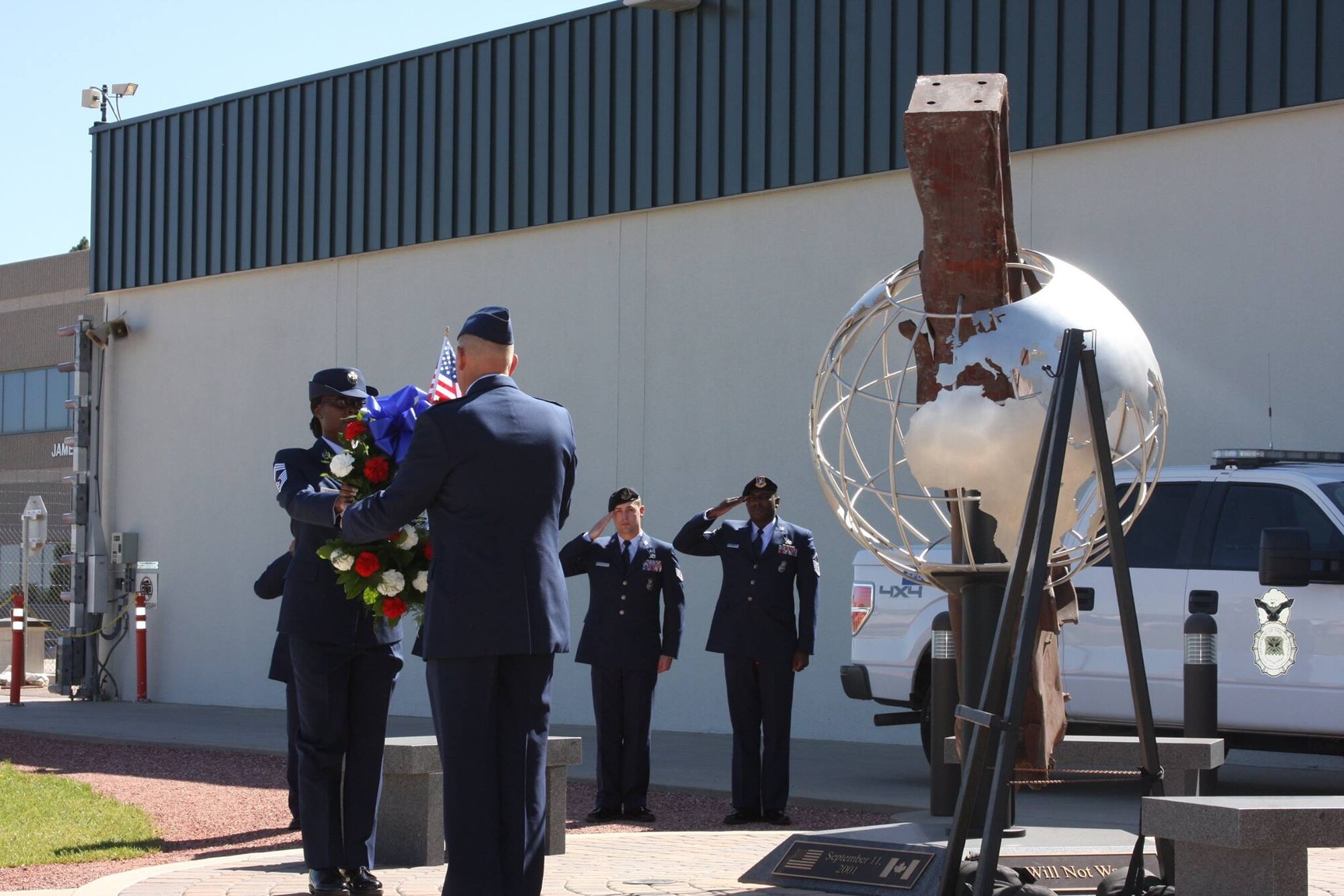 CHEYENNE MOUNTAIN AIR FORCE STATION, Colo. - Memorial wreaths are presented at the 9/11 memorial during a commemoration held at Cheyenne Mountain Air Force Station, Colo., Sept. 9, 2016. Service members and community partners remembered the lives lost during the terrorist attacks from 15 years ago. (courtesy photo)
