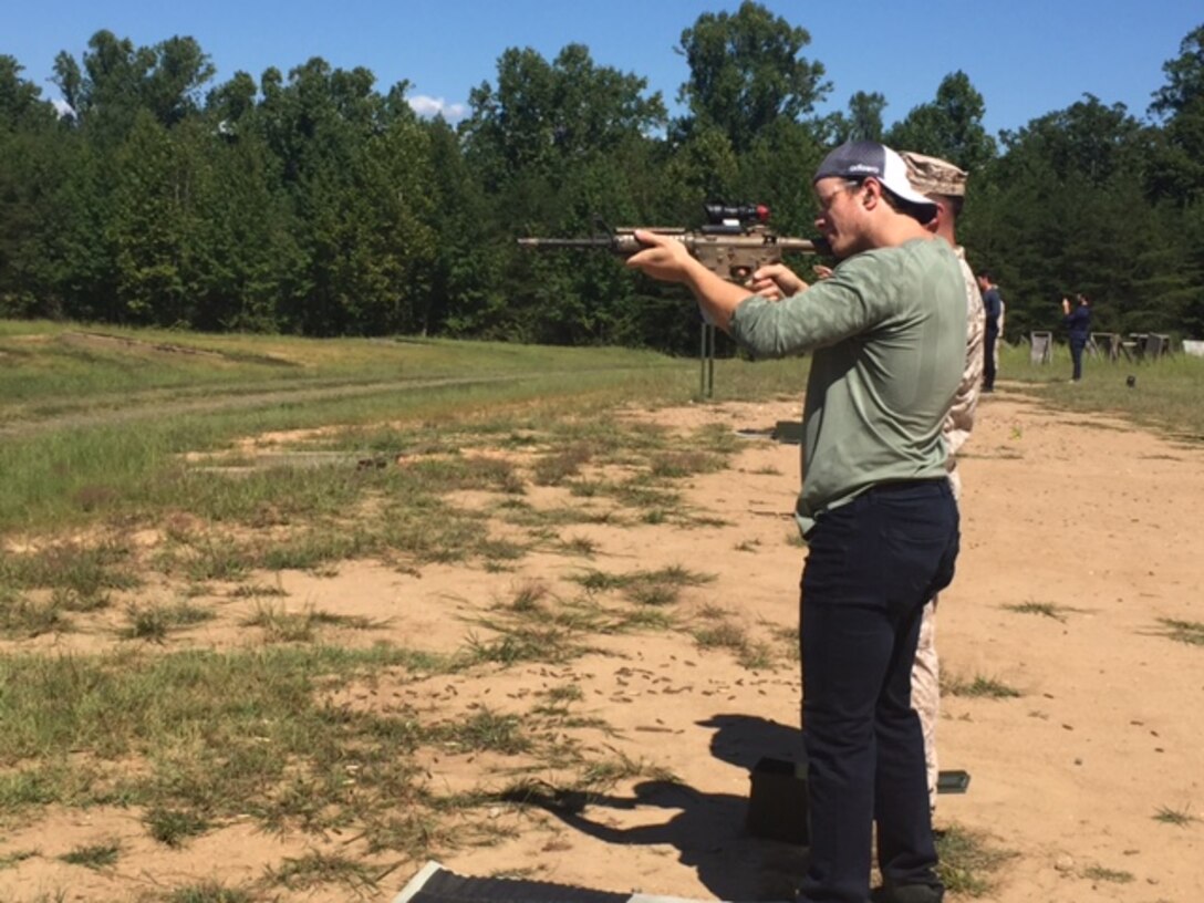 NHL player, Ryan Suter, tries out his marksmanship skills on the firing range at Marine Corps Base Quantico. Suter and the rest of the U.S. National Men's Hockey team came to MCBQ to share lunch and conversation with Marines at Malachowski Hall before heading out to the range to fire various weapons under the supervision of drill instructors.
