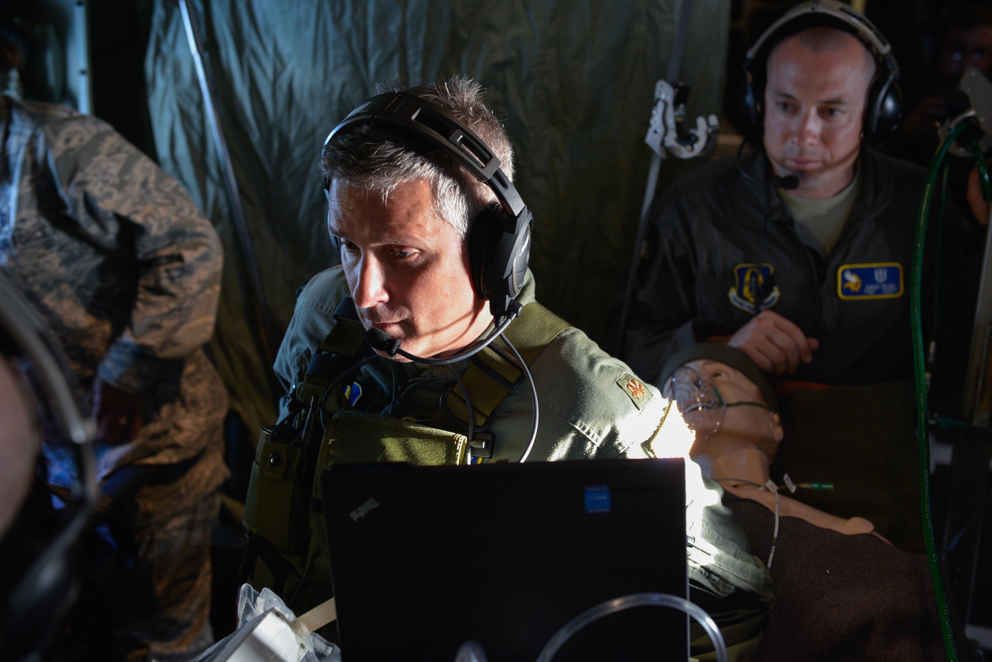 Maj. Steven Murphy communicates vital signs to members of the CCATT team.