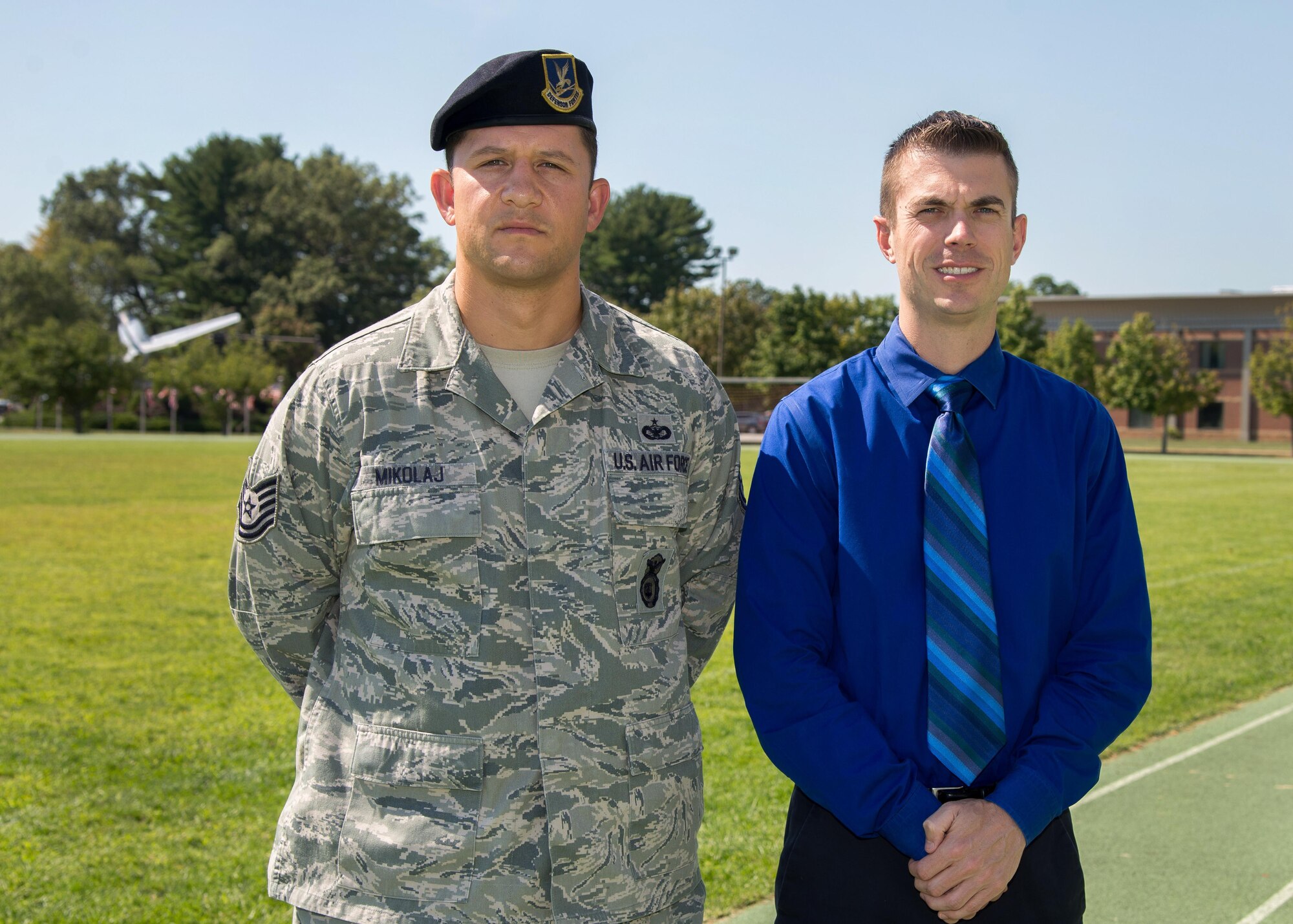 Tech. Sgt. John Mikolaj, Sr., a member of the 66th Security Forces Squadron, and Nicholas Kollett, a program manager for the C3I Infrastructure Division, will run the Air Force Marathon Sept. 17 at Wright-Patterson Air Force Base, Ohio, for the Air Force Enlisted Village. Mikolaj and Kollett are part of a 41-member team that hopes to raise $100,000 for the enlisted village. (U.S. Air Force photo by Mark Herlihy)
